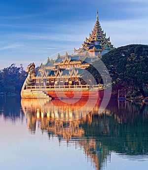 Floating golden Karaweik palace  looks like royal barge at sunset on Kandawgyi Lake in Yangon  Myanmar