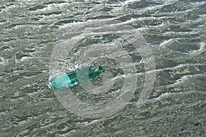 Floating green bottle