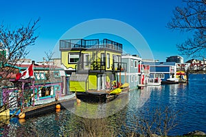 Floating Home Village colorful Houseboats Water Taxi Fisherman`s Wharf Reflection Inner Harbor, Victoria British Columbia Canada