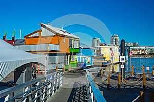 Floating Home Village colorful Houseboats Water Taxi Fisherman`s Wharf Reflection Inner Harbor, Victoria British Columbia Canada