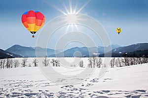 Floating hot air balloons over lake tegernsee, germany