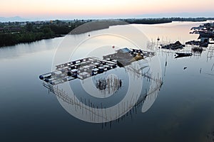 Floating house of fishermen at sunset on the Thu Bon river. Hoi an