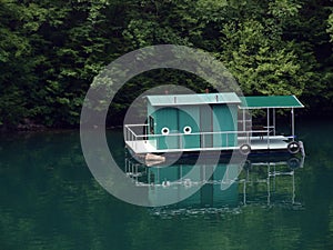 Floating house on lake.