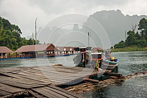 Floating houses and long tail boats at Chieou Laan lake
