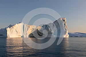 Floating icebergs in Disko Bay during the midnight sun