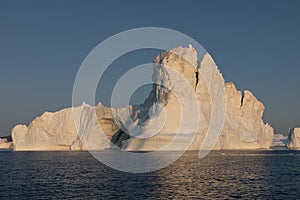 Floating icebergs in Disko Bay during the midnight sun