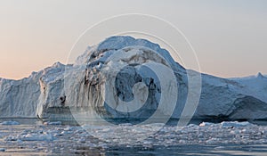 Floating icebergs in Disko Bay during the midnight sun