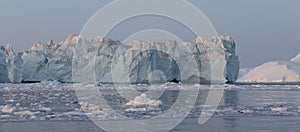 Floating icebergs in Disko Bay during the midnight sun