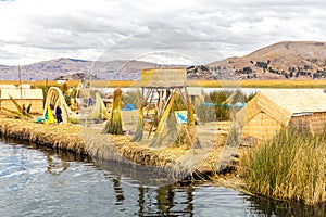 Floating Islands on Lake Titicaca Puno, Peru, South America, thatched home.