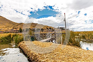 Floating Islands on Lake Titicaca Puno, Peru, South America, thatched home.