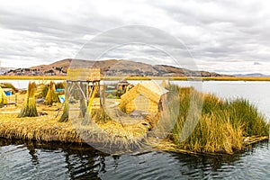 Floating Islands on Lake Titicaca Puno, Peru, South America, thatched home. Dense root that plants Khili