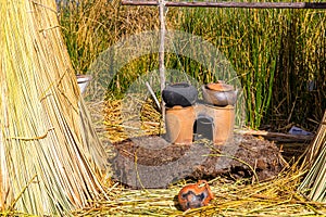 Floating Islands on Lake Titicaca Puno, Peru, South America, thatched home. Dense root that plants Khili