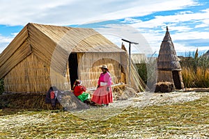 Floating Islands on Lake Titicaca Puno, Peru, South America, thatched home. Dense root that plants Khili interweave