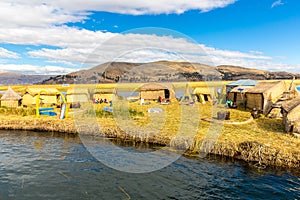 Floating Islands on Lake Titicaca Puno, Peru, South America, thatched home. Dense root that plants Khili photo