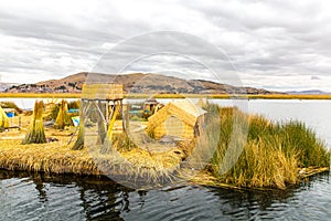 Floating Islands on Lake Titicaca Puno, Peru, South America, thatched home. Dense root that plants Khili photo
