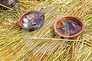 Floating Islands on Lake Titicaca Puno, Peru, South America, thatched home. Dense root that plants Khili interweave photo