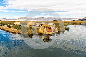 Floating Islands on Lake Titicaca Puno, Peru, South America, thatched home. Dense root that plants Khili interweave photo