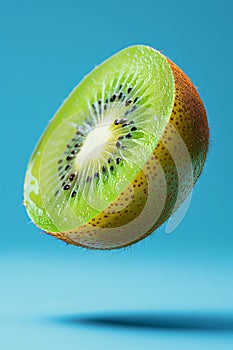 Floating Kiwi Half with Droplets Against Blue Sky