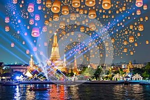 Floating lamp and laser show in yee peng festival under loy krathong day at Wat Arun, Bangkok, Thailand