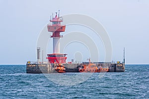 Floating lighthouse and boat in Kiel