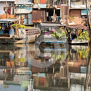 Floating market with reflection in water.