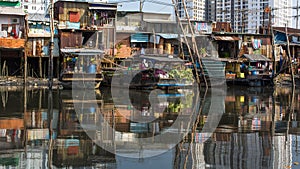 Floating market with reflection in water.