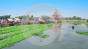 Floating market on the river side at Supanburi province, Thailand