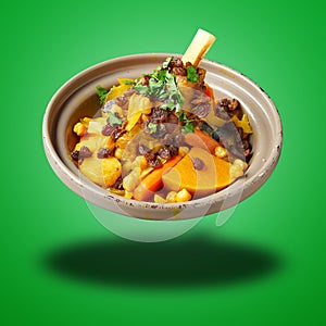 Floating Morroccan lamb Couscous on green gradient