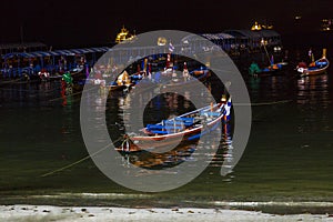 Floating night pier of traditional Thai boats and dormitory of boaters.