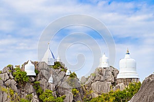 Floating pagoda on peak of mountain at Wat Chaloem Phra Kiat Phra Bat Pupha Daeng temple in Chae Hom district, Lampang, Thailand photo