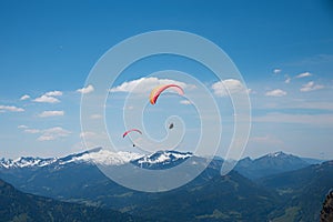 Floating paraglider in allgau alps