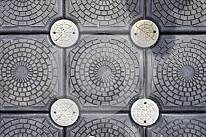 Floating pavement blocks joined with circular cylindrical blocks photo