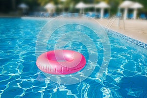 Floating ring on blue water swimpool