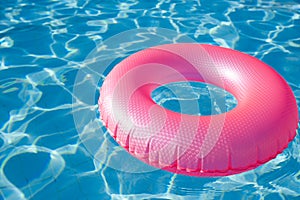 Floating ring on blue water swimpool