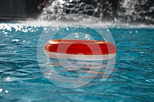 Floating ring on blue water swimpool