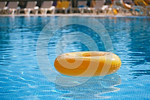 Floating ring on blue water swimpool