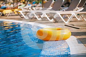 Floating ring on blue water swimpool