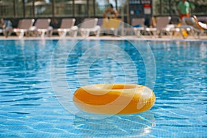 Floating ring on blue water swimpool