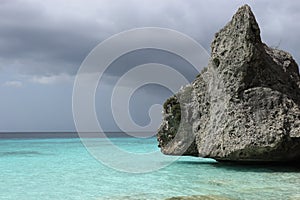 Floating rock in calm and turquoise sea
