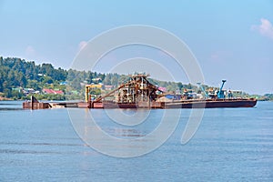 Floating sand mining plant - dredger and separator - on the river