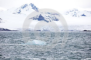 Floating sea ice near a massive glacier in the arctic