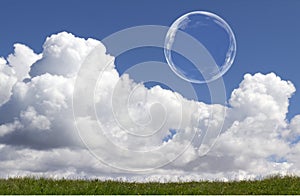 Floating Soap Bubbles Against Clear Sunlit Blue Sky and Clouds
