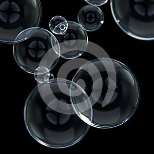 Floating soap bubbles on black background