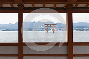 The Floating Torii gate framed by Itsukushima shrine in Miyajima, Japan.