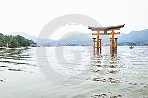 The Floating Torii gate with waves in Miyajima, Japan.