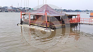 FLOATING TRADITIONAL HOUSE ON THE RIVER