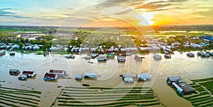 Floating village along Hau river over Vietnam border area, aerial view