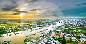 Floating village along Hau river over Vietnam border area, aerial view