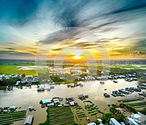 Floating village along Hau river over Vietnam border area, aerial view