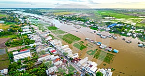 Floating village along Hau river over Vietnam border area, aerial view